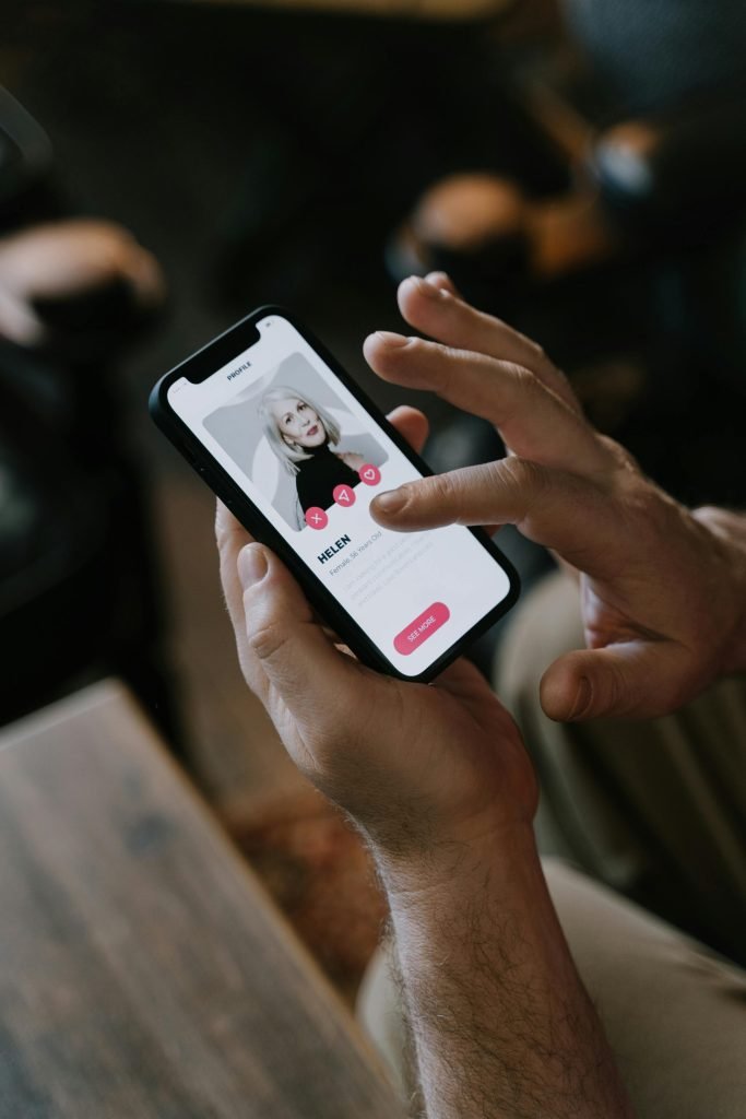 Person Looking at a Contact in Cellphone